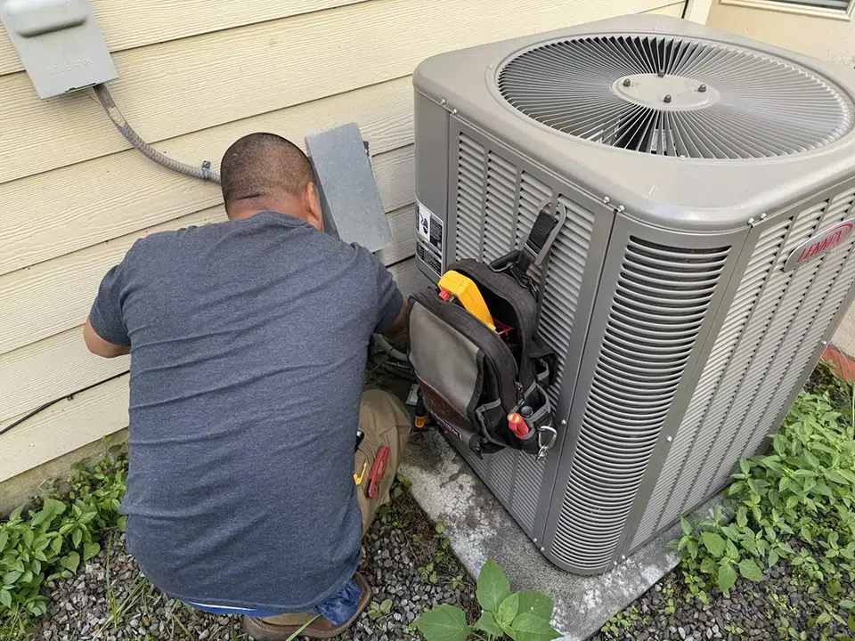 Luke's tech performing AC maintenance