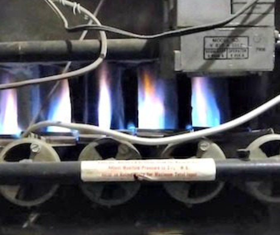 inside view of furnace with blue flames
