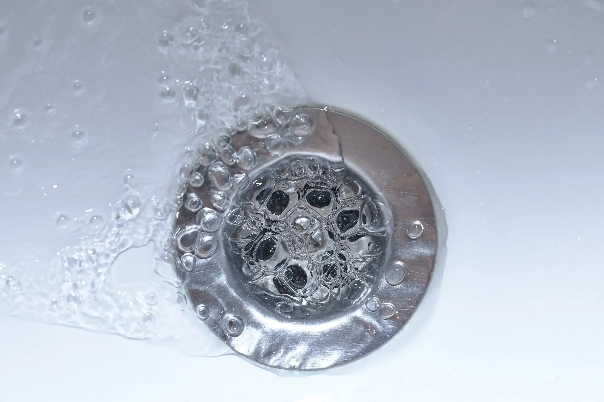 water draining into sink drain