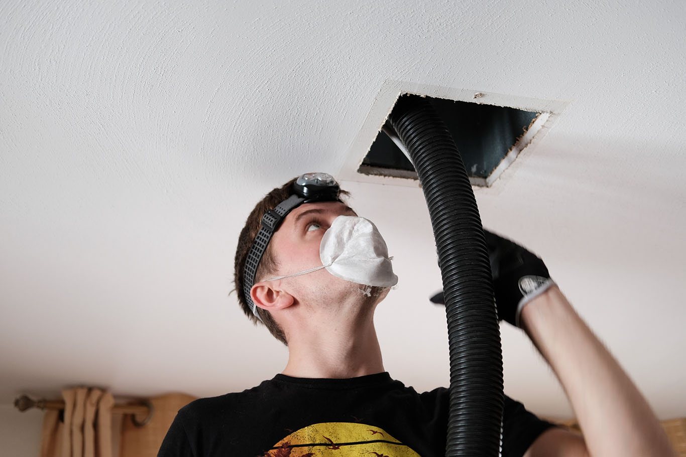 Technician working on duct cleaning - Luke's Plumbing & Air Conditioning